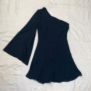 One sleeved blue chiffon evening dress.